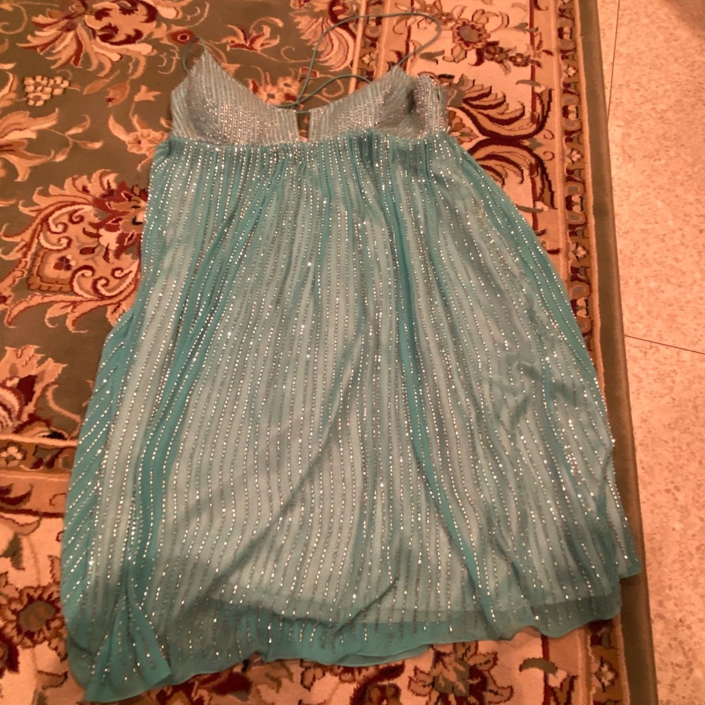 Adrianna Papell turquoise dress with silver beaded crystals. Criss cross back.